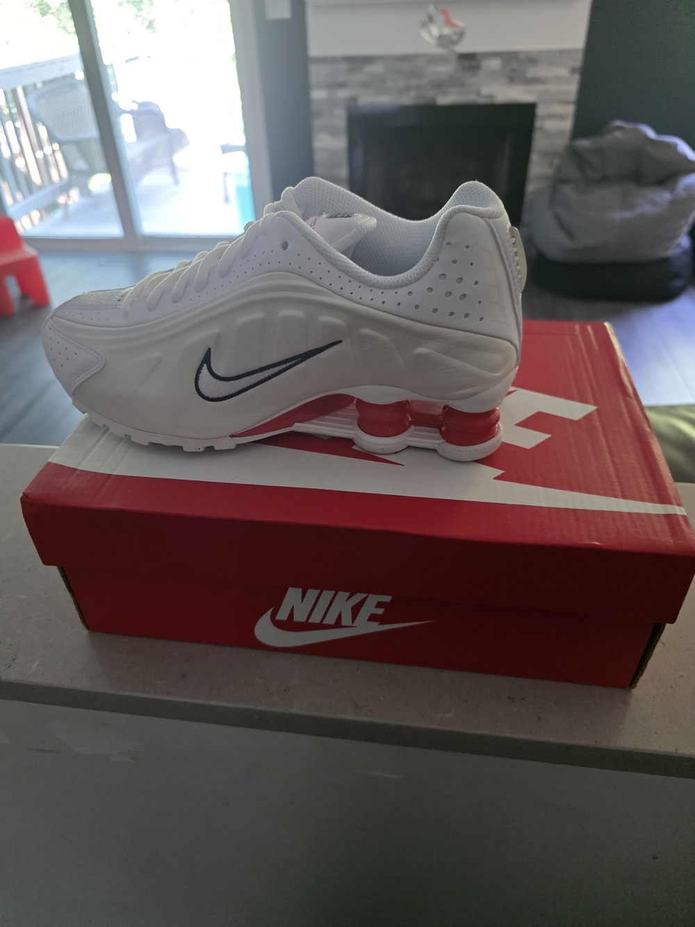 Nike Shox White Sneakers with Red Cushioning